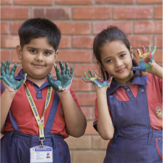 Smiling schoolers enjoying playful learning in MBIS Patna's
